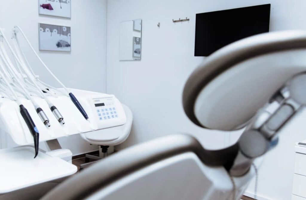 Empty dentist's chair with instruments