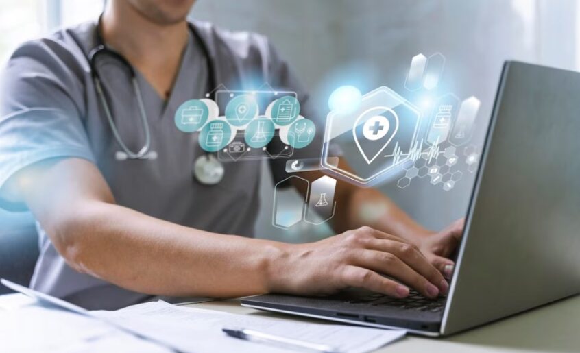 a young doctor working on a laptop