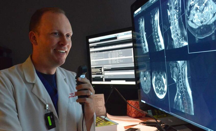 radiologist at Naval Hospital Jacksonville, reviews an MRI