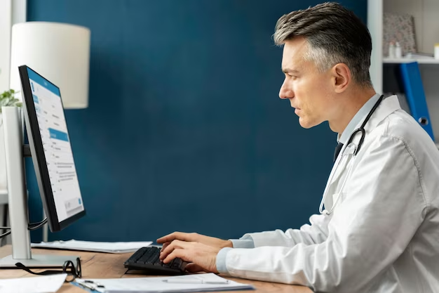 Doctor Using a Computer